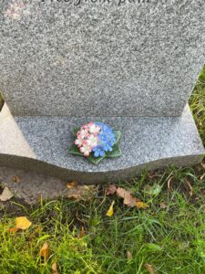 forget me not and primrose on grave