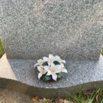 lily base on grave stone