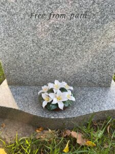 lily base on grave stone