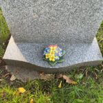 polyanthus on grave stone